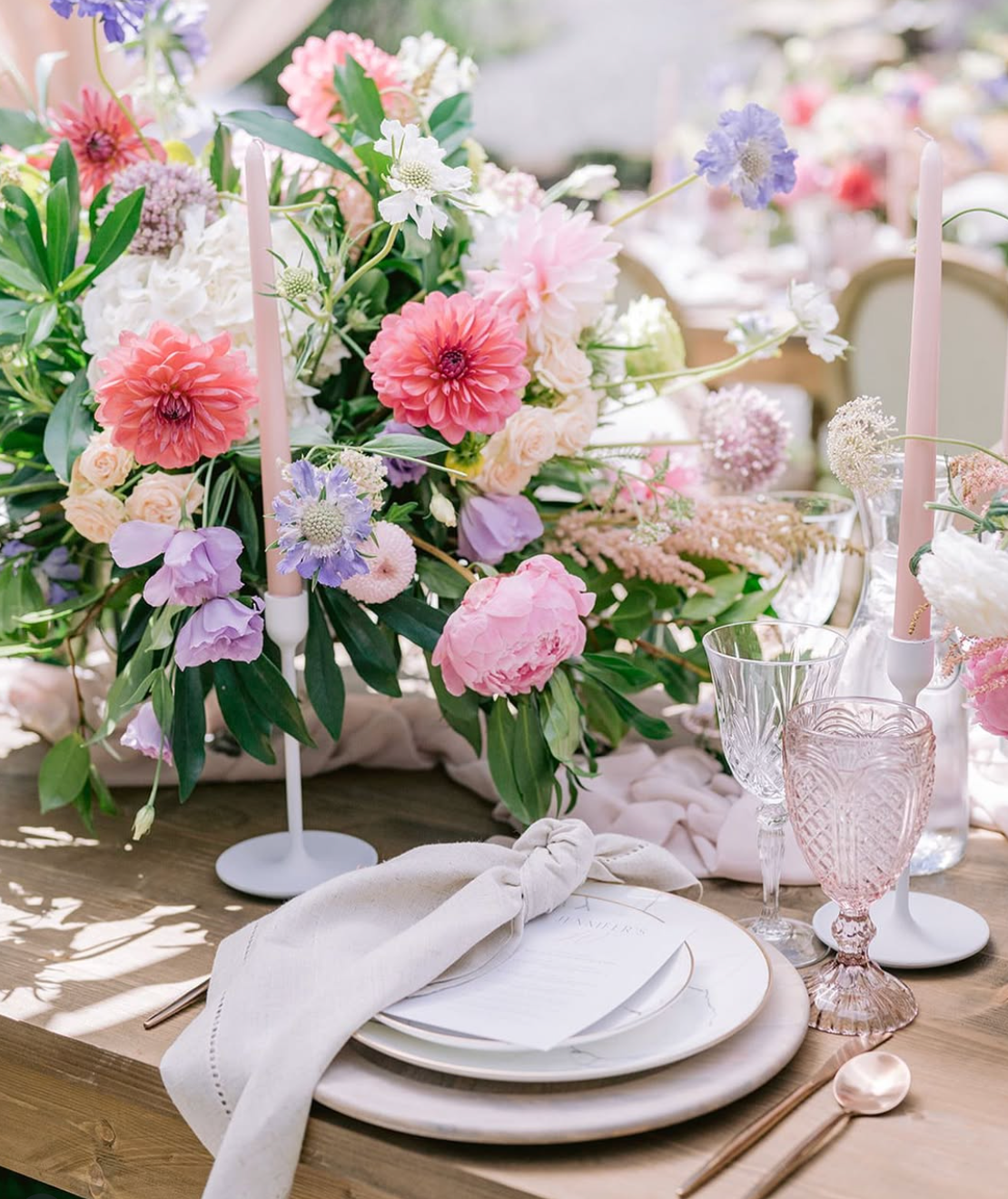 Blush vintage water goblets styled with romantic spring wedding florals